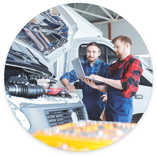 two men repairing a car